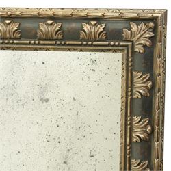 Modern neoclassical style wall mirror, rectangular plate with faux foxed and distressed finish, within a moulded frame decorated with repeating acanthus leaf blocks and beaded inner slip