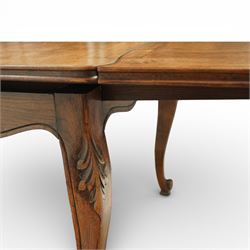 20th century French oak drawer-leaf extending dining table and six chairs, the rectangular parquetry top with moulded edge and rounded corners, pull-out draw leaves extending the table to 240cm, carved frieze with foliate detail, raised on cabriole supports with scroll terminals, the six matching chairs with shaped backs carved with floral motifs, paper cord seats woven with a green pattern, cabriole front supports and turned stretchers