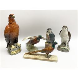 Collection of Beswick figures, comprising two whiskey decanters Beneagles osprey (sealed with contents), and golden eagle, (no contents), two pheasant models 850, and 1774, plus a Royal Doulton whiskey decanter, peregrine falcon, (no contents).   