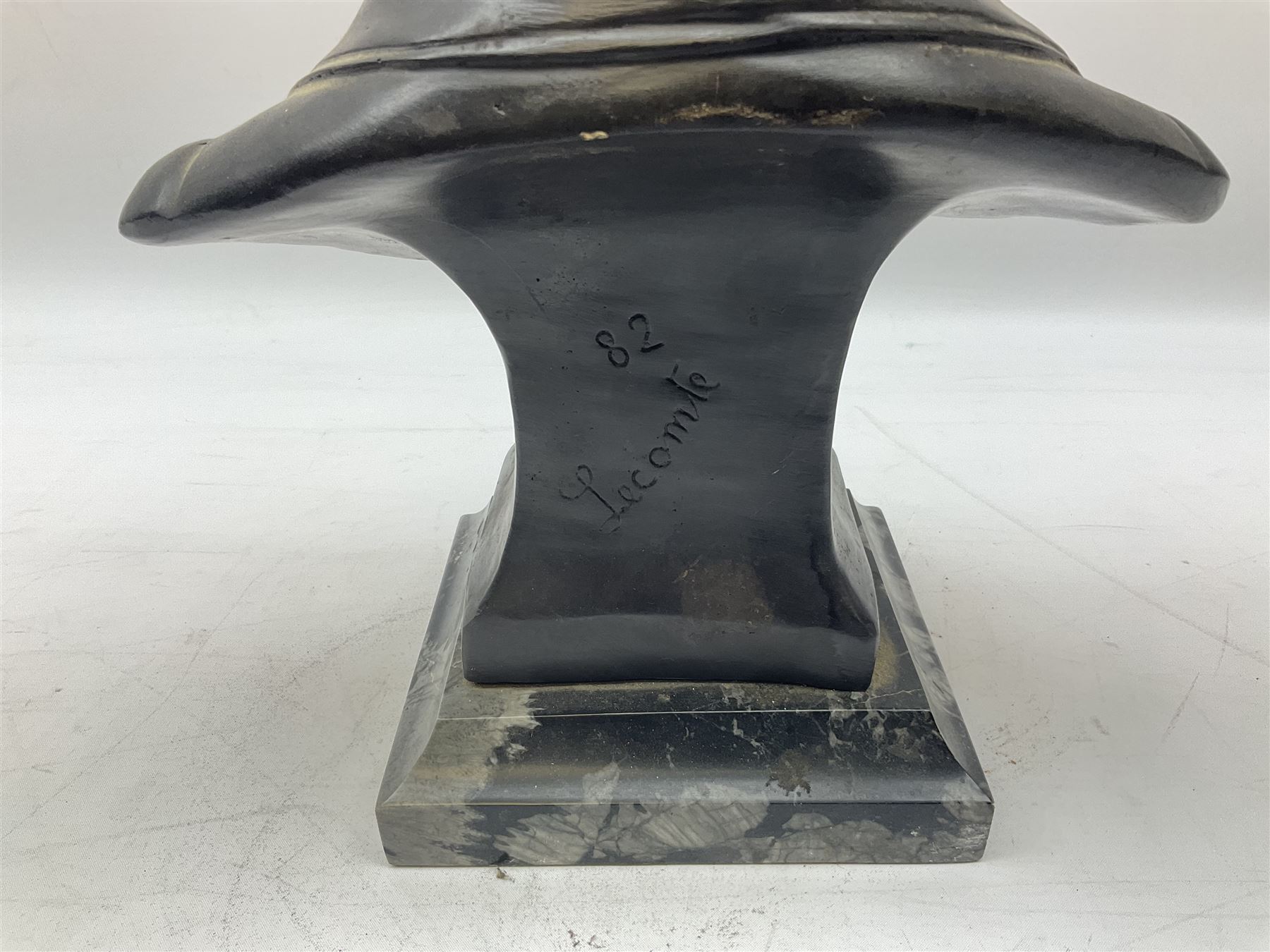 Bronze bust modelled as Napoleon, head and shoulders, wearing his hat and with open collar, on a tapering square section base, marked to the reverse 'Lecomte '82', H36cm