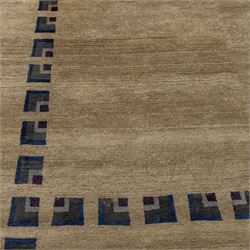 Rugs by Design - ‘Silk Stone’ Nepalese thick pile wool rug, with plain textured camel ground and geometric border detail in blue, grey and dark tones to all four sides