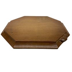 Mouseman - adzed oak breadboard, canted rectangular form with moulded edge carved with mouse signature, by the workshop of Robert Thompson, Kilburn, W31cm D25cm