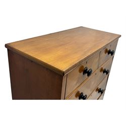 Late Victorian mahogany chest of drawers, with rectangular top over two short and three long graduated drawers, each fitted with ebonised turned knob handles and keyholes, raised on turned supports