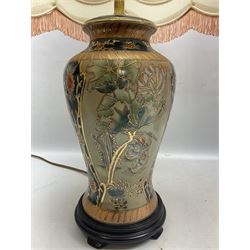Two table lamps comprising an ornate ceramic example of baluster form decorated heavily with flowers and gilt, and a composite examples, with shades, tallest H44cm excl fitting