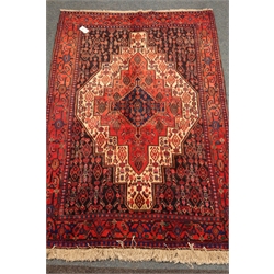  Kurdish red ground rug, central medallion, 168cm x 117cm  