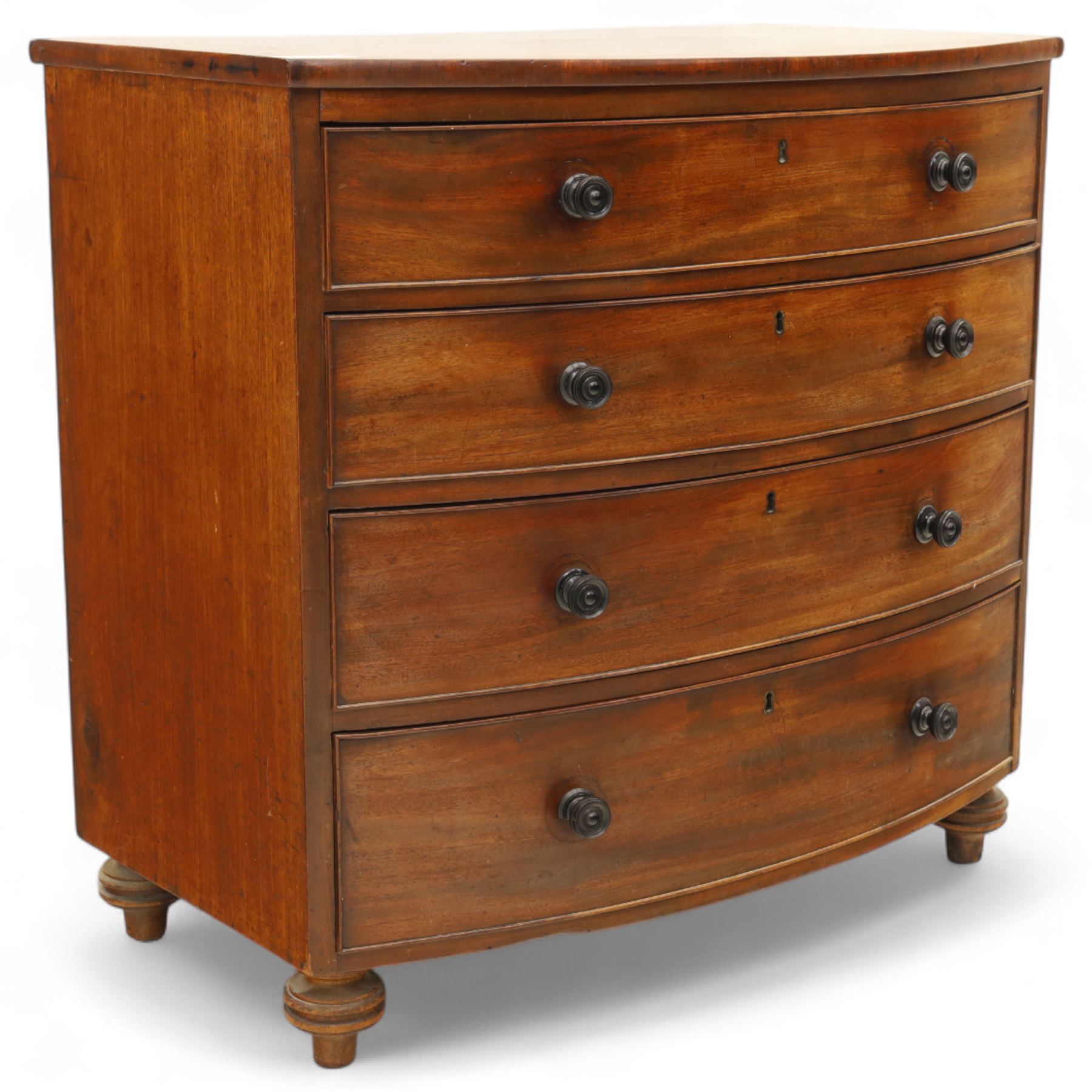 Mid-19th century mahogany bow front chest, fitted with four graduating drawers, turned ebonised handles, bun feet