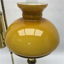 Brass adjustable student's oil lamp, with yellow glass shade, H52cm