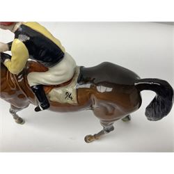 Beswick jockey on walking horse no 1037, in black white and yellow jockey colours, with printed mark beneath, H22cm