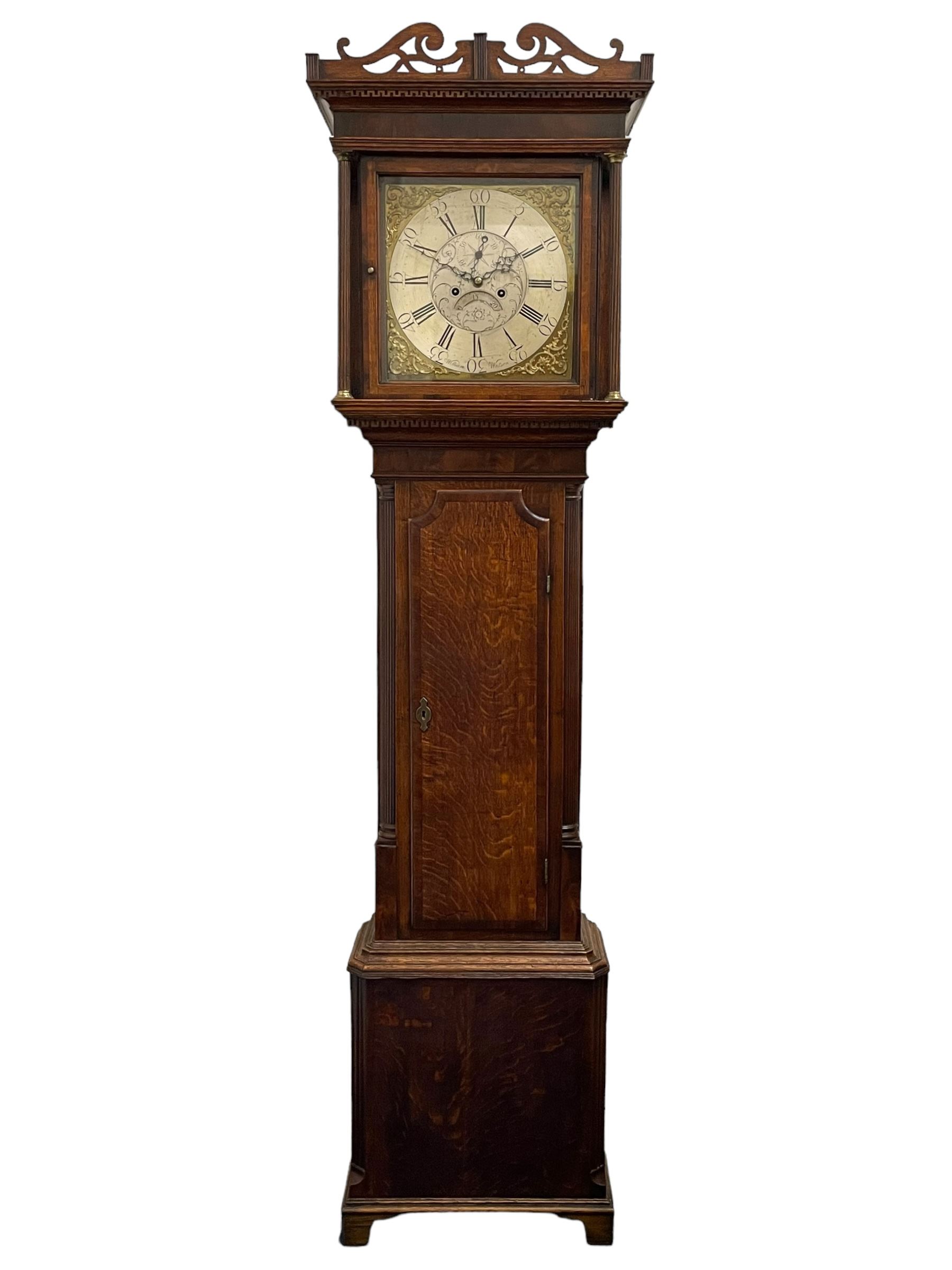 William Watson of  Blackburn (Lancs)  - late 18th century 8-day oak and mahogany cross banded longcase clock, with a flat top and open fretwork above, deep cornice with dogtooth moulding and frieze beneath, square hood door flanked by reeded pilasters with brass capitals, trunk with  reeded quarter columns, long trunk door with concave corners on a plinth with canted corners on bracket feet, brass dial with cast brass spandrels, broad silvered chapter ring with Roman numerals and five-minute Arabic's, a profusely engraved and silvered dial centre with seconds dial, matching steel hands and calendar aperture, hourly rack striking movement with a recoil anchor escapement. With weights, pendulum and key. 
William Watson of Northgate, Blackburn, is recorded as working c1770-1814 . As with this clock Watson frequently signed some of his clocks without a placename.