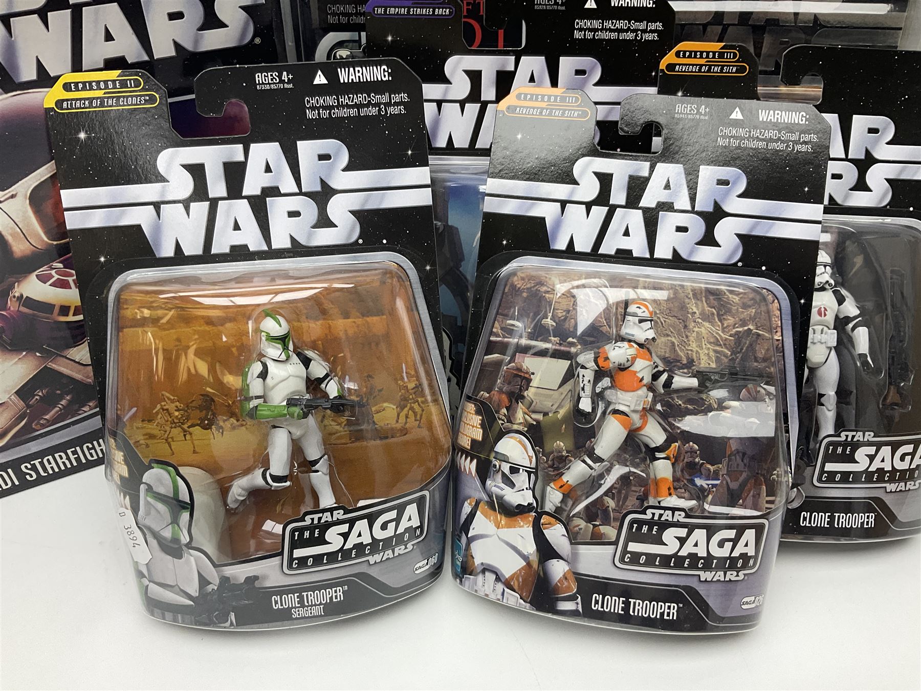 Star Wars - The Saga Collection - Mace Windu's Jedi Starfighter; boxed; and twelve carded figures comprising Biker Scout, General Grievous, At-At Driver, Clone Trooper Sergeant, various other Clone Troopers and Commander Cody, Snowtrooper and Scorch Republic Commander; all in unopened blister packs (13)