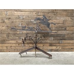 Black painted wrought iron weather-vane depicting hunting scene and compass points