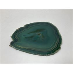 Pair of green agate slices, polished with rough edges, raised upon silvered metal stands, H23cm