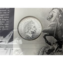 Four The Royal Mint United Kingdom twenty pounds fine silver coins dated 2013 'A Timeless First', 2014 'Outbreak' 2015 'The Longest Reigning Monarch' and 2015 'Sir Winston Churchill', all on cards