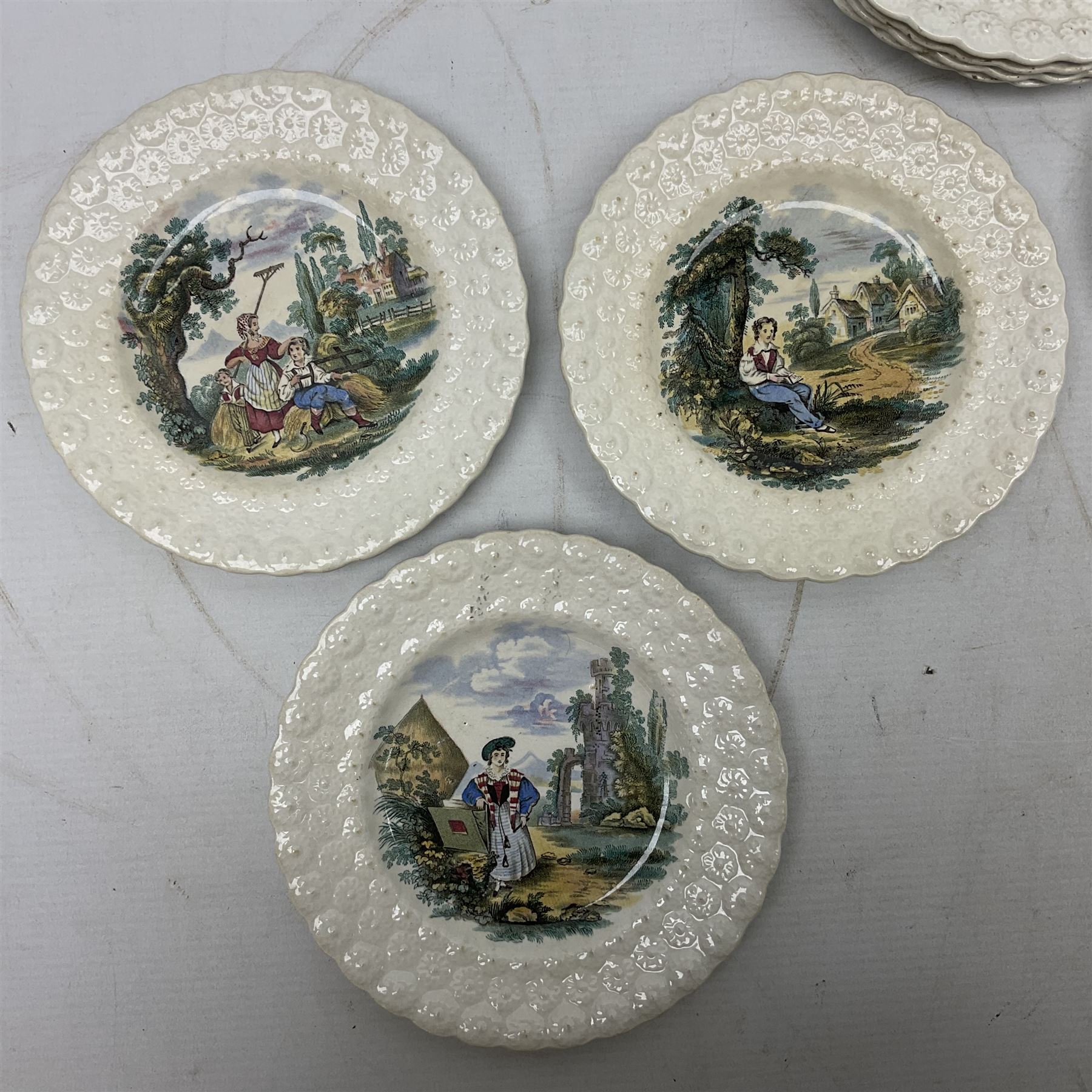 Collection of 19th century William Smith & Co nursery plates, to include examples decorated in the pastime series, and similar, all with moulded floral borders