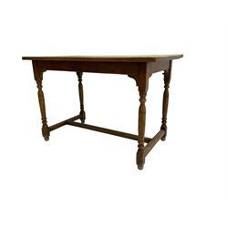 Early 20th century oak kitchen table, raised on turned supports united by H stretcher