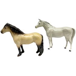 Beswick horse figures, comprising Highland Pony 1644, and another, probably Aran Bahram in grey, each with printed mark beneath.
