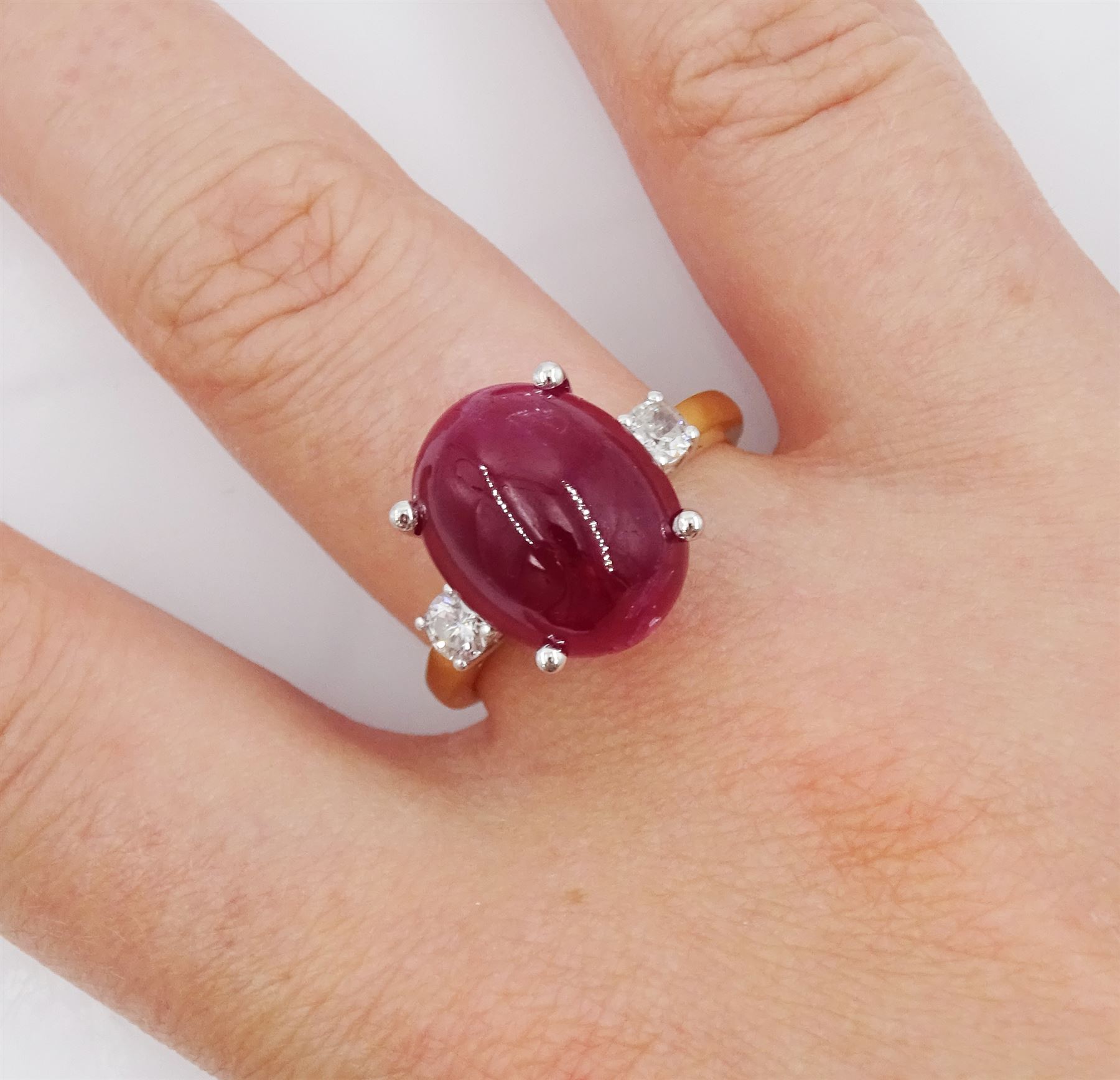18ct gold three stone cabochon ruby and round brilliant cut diamond ring, hallmarked, ruby approx 11.40 carat