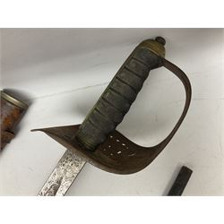 George V 1897 pattern Infantry officers sword, the 82cm single fullered blade with traces of etched detail and George V crown cipher, the ricasso marked Hawksworth Sheffield, pierced half basket hilt with George V cypher, wire-bound fish-skin grip with brass pommel and backstrap; in leather scabbard L102cm overall; together with two sectional gun cleaning rods; swagger stick made of leather strips etc