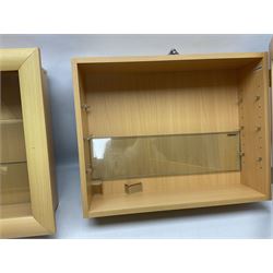 Set of four Livarno wall mounting model display cabinets, each with simulated beech finish and side hinged glazed door enclosing adjustable plate glass shelves W62.5cm H50cm D17cm (4)