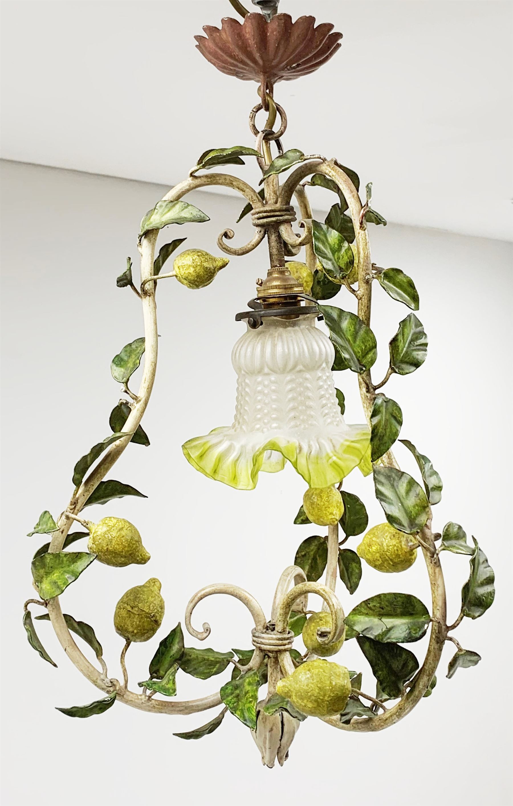 A toleware light fitting modelled with fruiting lemon vines around a frilled glass shade, approximately H48cm