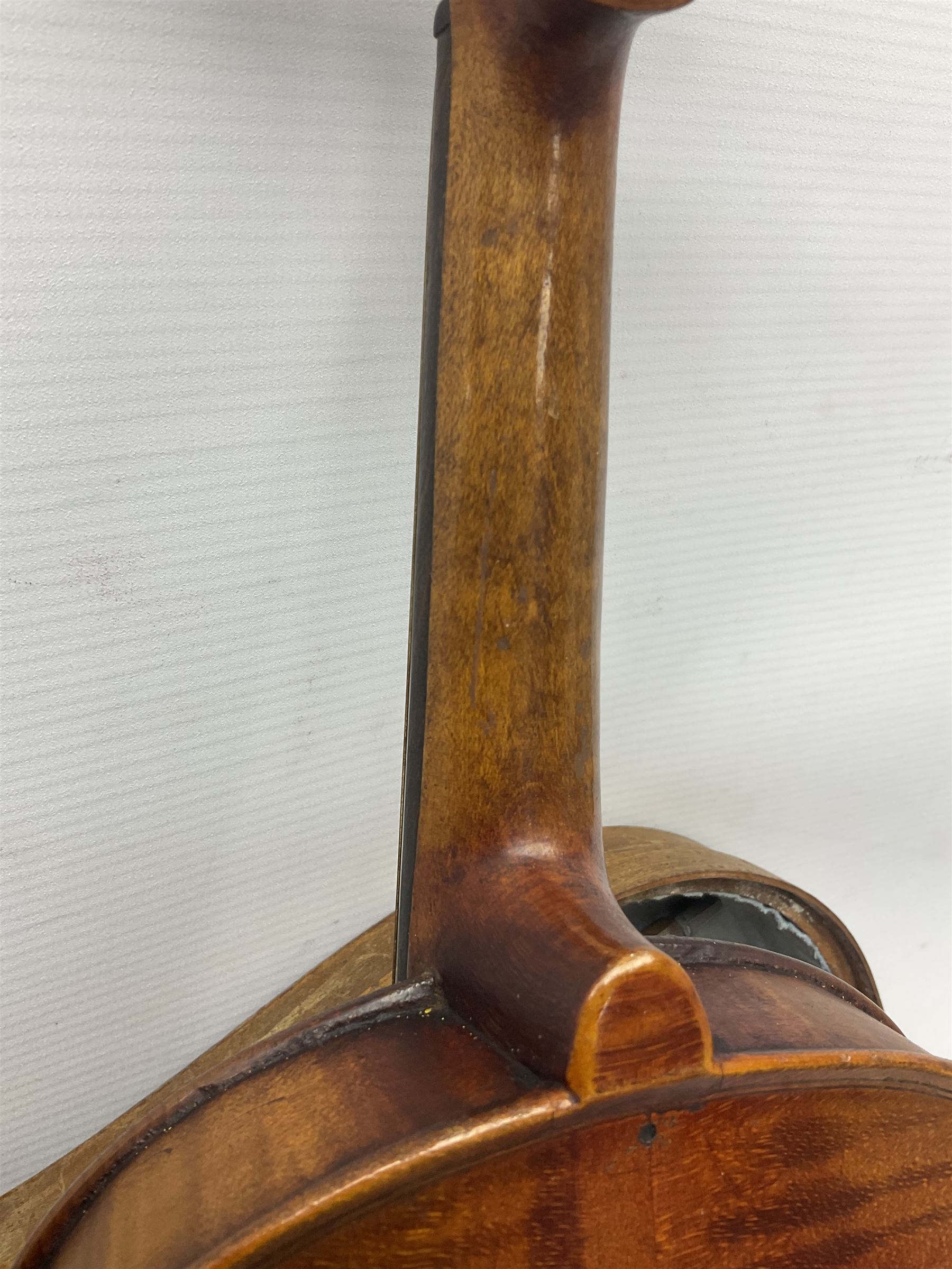 Mid-19th century German violin with 36cm two-piece maple back and ribs and spruce top, bears label 'Riccardo Antoniazzi Cremonese fece in Milano l'anno 1896' L59.5cm overall; in walnut case with two part bows