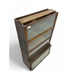 Globe Wernicke - early 20th century oak four-tier stacking library bookcase, four glazed sections enclosed by hinged and sliding doors