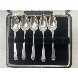 Set of six 1920's silver coffee spoons, hallmarked Sheffield, contained within a fitted case, together with a set of five George III bright cut engraved teaspoons, also cased, approximate total silver weight 77 grams