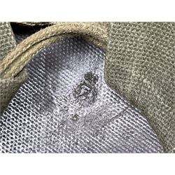 American first type paratrooper helmet with post-WW2 strap and D-rings and later 1944 liner bearing Firestone Tyre and Rubber Company mark; green textured finish