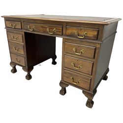 Early 20th century mahogany twin pedestal desk, fitted with nine drawers, on ball and claw carved cabriole feet