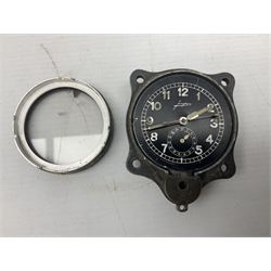 WW2 Jungans Luftwaffe aircraft cockpit clock with luminous centre sweep seconds hand, baton hour and minute hands, regulation 45mm black dial with date recorder, formerly illuminous Arabic numbers and minute track, rotating bezel (seized), going barrel movement with a lever escapement serial No 22901 jewelled to the centre wheel, over-sprung balance with timing  screws, max.H8cm
