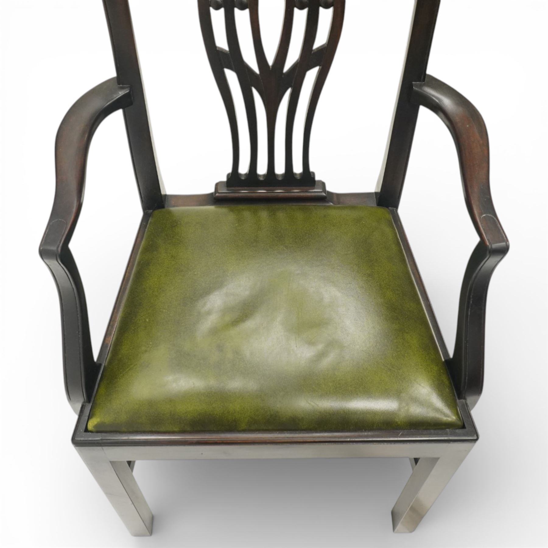 Set of eight Georgian style mahogany dining chairs, comprising six chairs and two carvers, the shaped top rails above pierced vase splats, and green leather upholstered drop in seats, upon square legs united by stretchers