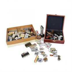 Large collection of lighters, including novelty gun and camera examples, Art Deco table lighter by Benlow Golmet, circular John F Kennedy example and other smoking accessories