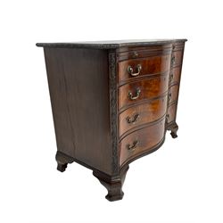 Chippendale design serpentine chest, shaped moulded top carved with repeating flower head motifs, fitted with brushing slide over four graduating drawers, pierced and foliate moulded handle plates with scrolled swan neck handles, canted upright corners carved with flower heads and strapwork, on canted ogee bracket feet