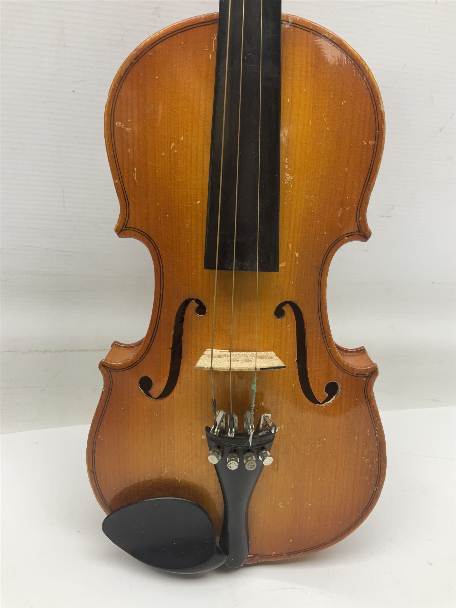 Four Chinese graduated violins - full size with 35.5cm two-piece back; three-quarter size with 33.5cm two-piece back; half size with 31cm two-piece back; and quarter size with 27.5cm two-piece back; all cased except full size; one with bow (4)