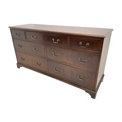 Georgian design mahogany chest, rectangular crossbanded top with stringing, fitted with seven assorted drawers with cock-beaded facias, on bracket feet