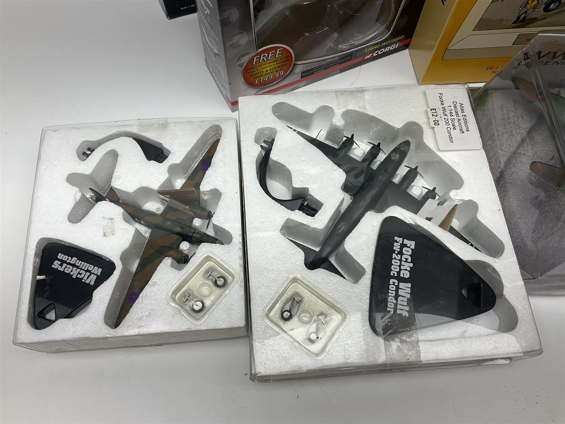 Fifteen modern die-cast models of aircraft by Corgi, Atlas Editions and Ixo including Aviation Archive, War Birds, Fighters of WWII etc; and model of an MGB Sports Car; all boxed (16)