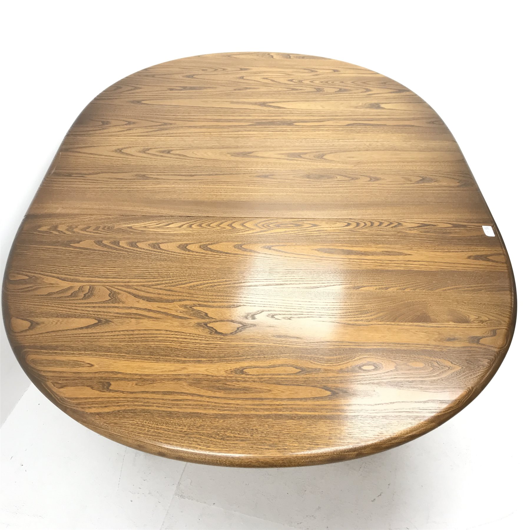 Ercol elm Old Colonial extending pedestal dining table with single leaf (W115cm and 165cm, H73cm, D115cm) and set six hoop back dining chairs (W43cm) 