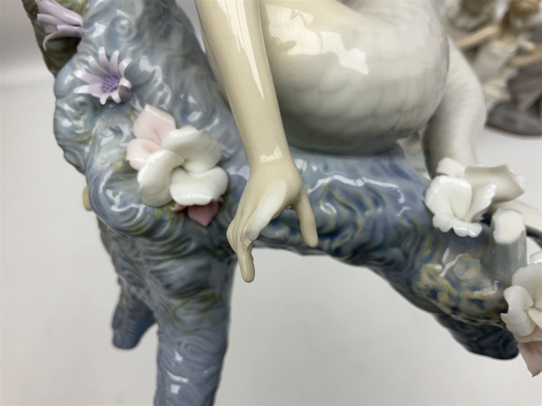 Four Lladro figures, comprising Touch of Class no 5377, Boy Student no 4517, Ocean Beauty no 5785 and Carnival Couple no 4882, largest example H45cm