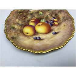 Mid 20th century Royal Worcester cabinet plate decorated by John Freeman, of circular form with gilt shaped rim, hand painted with a still life of fruit upon a mossy ground, signed Freeman, with black printed mark beneath, D27cm