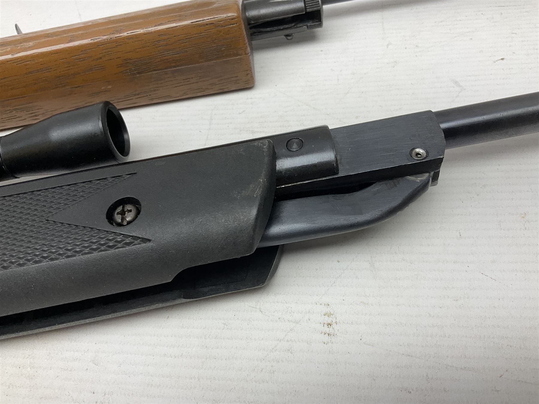 Crosman 760 .177 cal. Junior air rifle with under lever faux pump action and simulated wooden fittings; serial no.278047476, L90cm overall; and SMK B1 Synthetic .22 cal. Youth's air rifle with break-barrel action and 4 x 20 scope; serial no.1721229956084915F, L98.5cm overall (2)  NB: AGE RESTRICTIONS APPLY TO THE PURCHASE OF AIR WEAPONS.