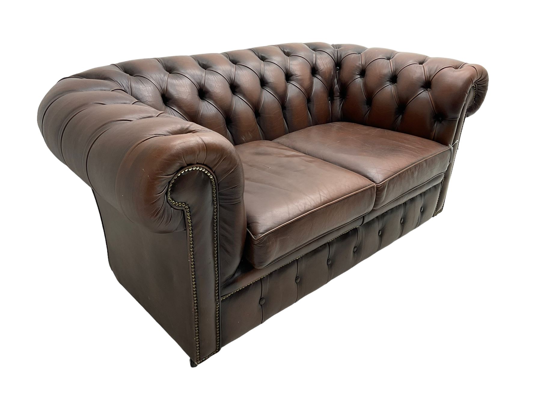 Chesterfield two seat sofa, upholstered in brown buttoned leather