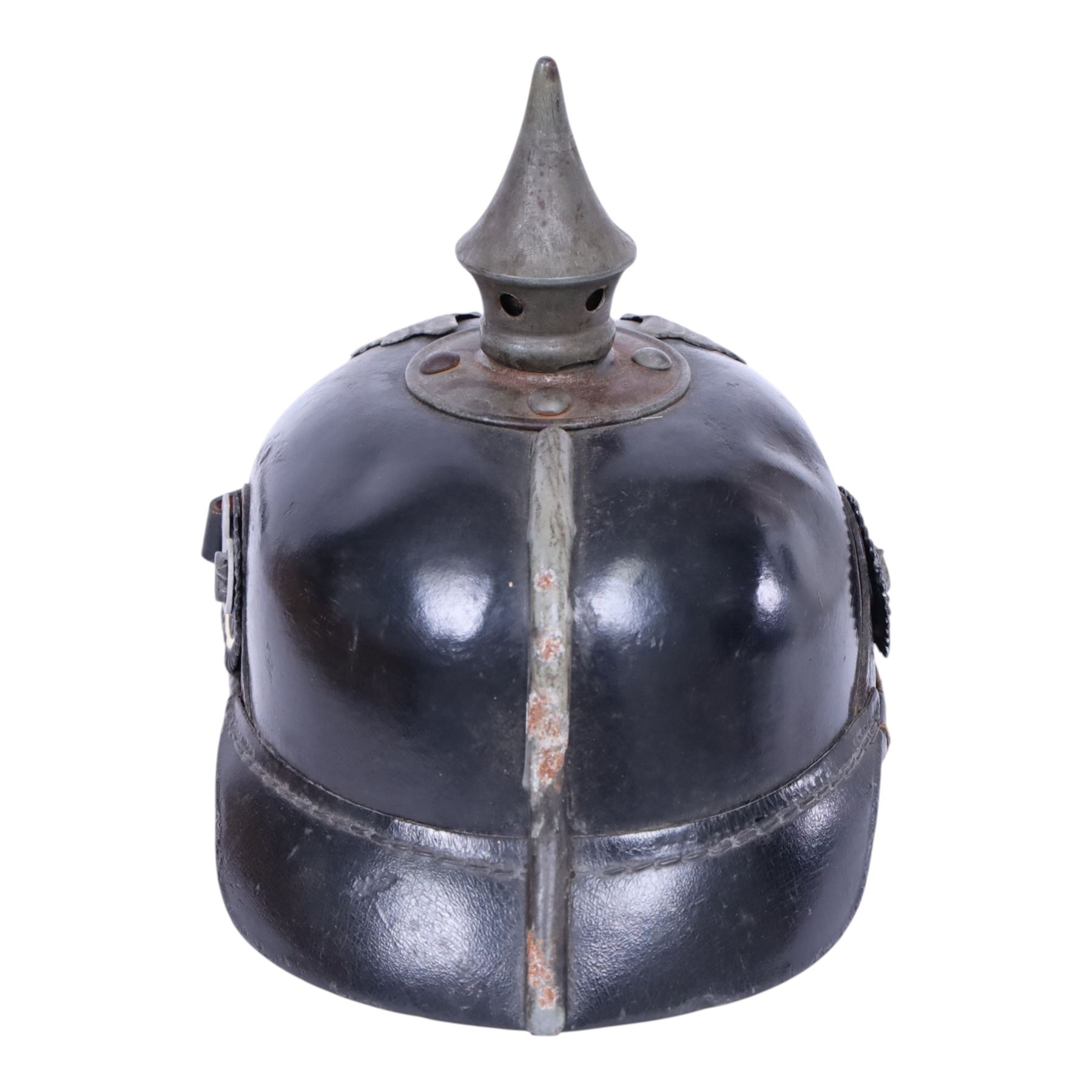 WWI Prussian M1915 Pickelhaube, the black leather skull with removable steel spike finial, steel eagle helmet plate and leather chin strap, one side with a black cockade, the other black and red