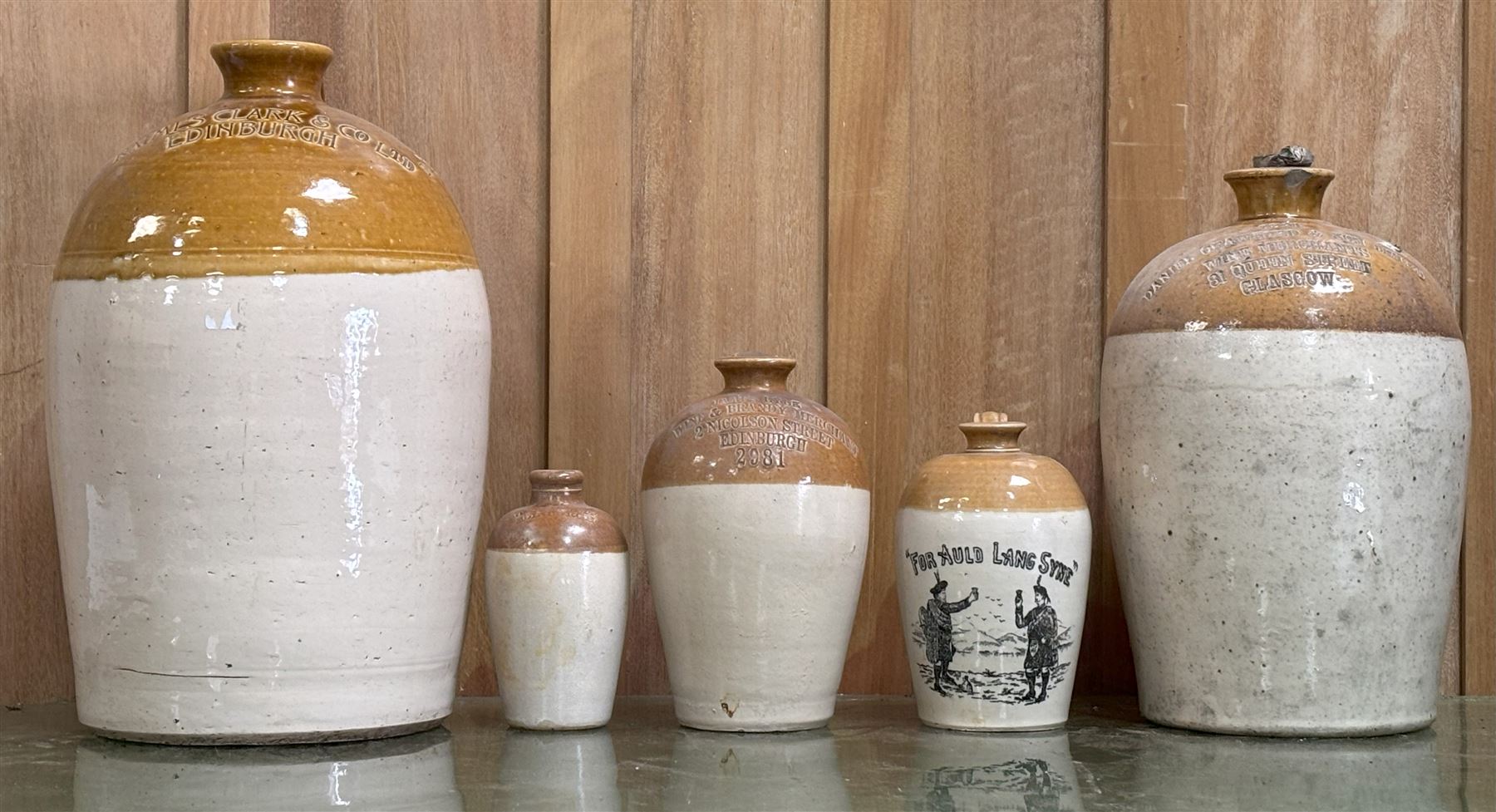 Group of 19th century Scottish stoneware alcohol flagons, including a pictorial 