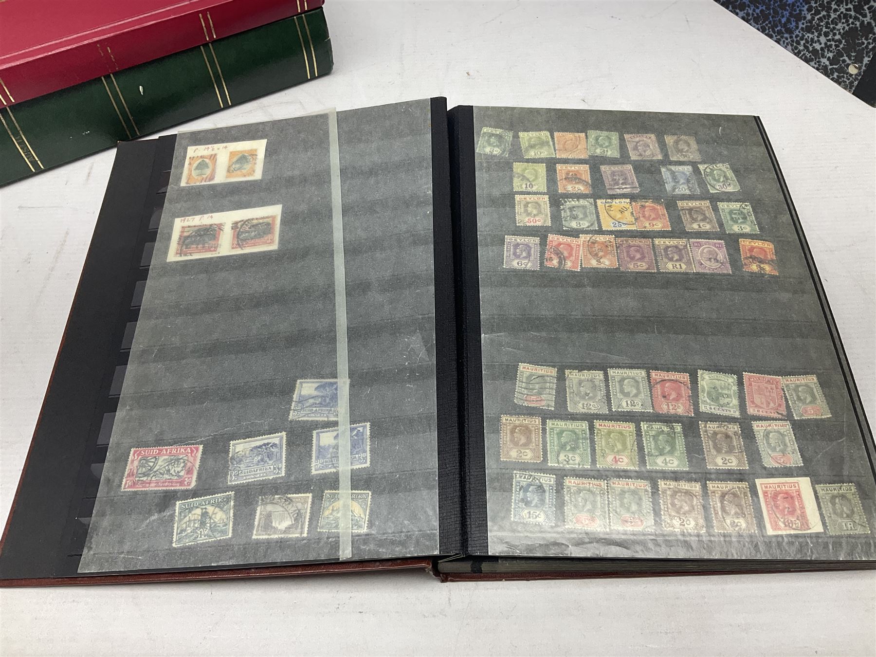 Stamps including Queen Victoria Queensland, modern Australia, King Edward VII Ceylon and Mauritius, South Africa, Gambia, Falkland Islands, Gold Coast, Ireland etc, housed in seven albums/folders and on loose album pages, in one box