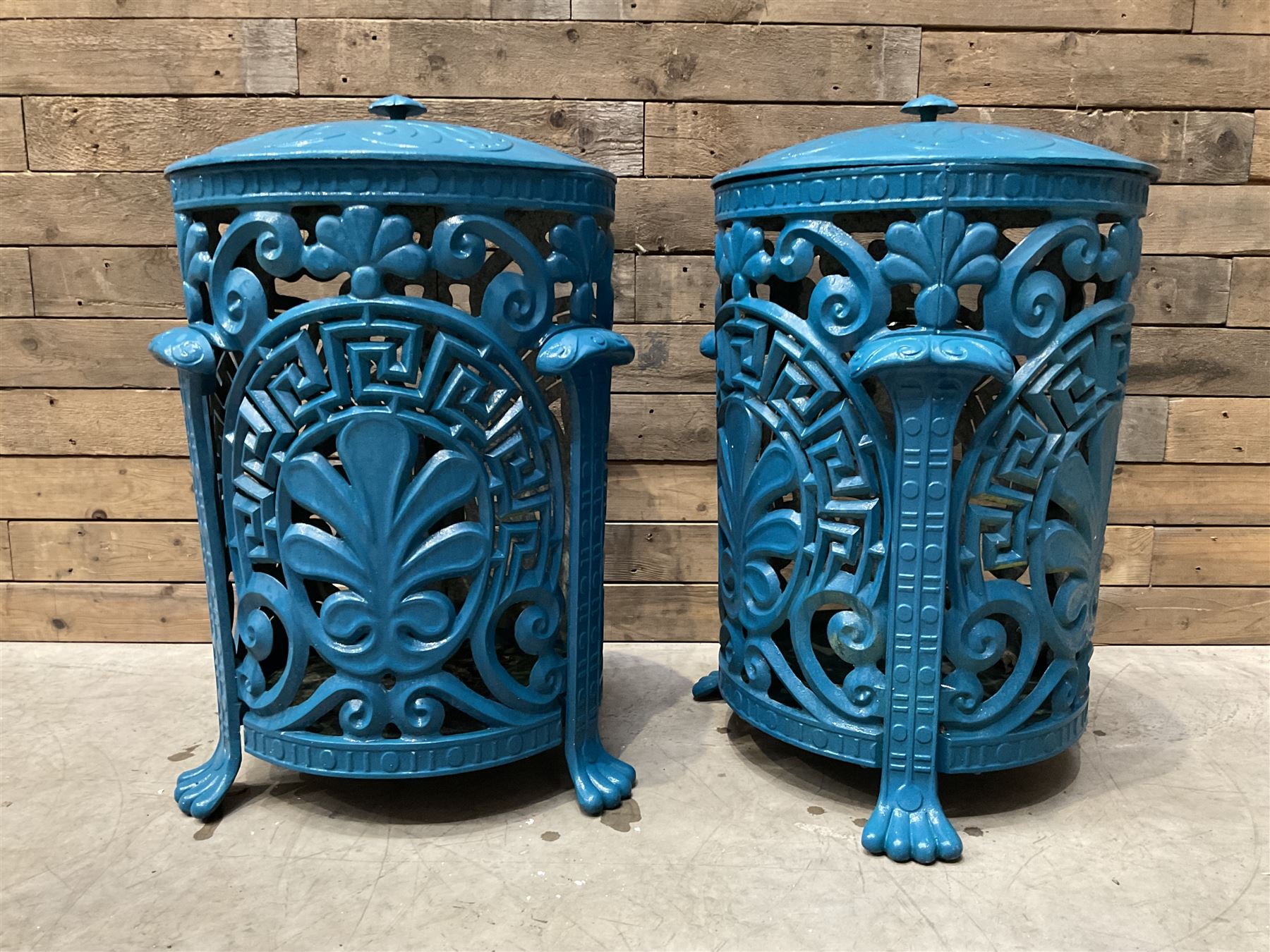 Pair of blue painted cast iron garden bins