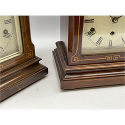 Close matching pair of German Westminster chiming mantle clocks c1910, inlaid mahogany case in the Edwardian Sheraton style with an engraved silvered sheet dial, Roman numerals, minute track and steel spade hands with subsidiary chime/silent dial above, eight-day spring driven three train movement sounding the quarters and hours on five gong rods. With pendulum.


