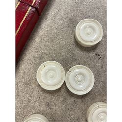 19th century walnut and brass bound games compendium box, painted to enhance the grain, of rectangular form, the hinged opening cover with rounded sides, central brass cartouche with engraved lion crest, and brass riveted straps, opening to reveal a red leather and blue silk lined compartmented interior, with fold-down games board, and lift-out tray containing playing cards, ebony turned dice towers, white and red stained bone draughts, and chess pieces, ivory dice, and ivory and ebony whist markers, and brass bezique board, cribbage board and markers, H15cm W32cm D24cm
This lot has been registered for sale under Section 10 of the APHA Ivory Act