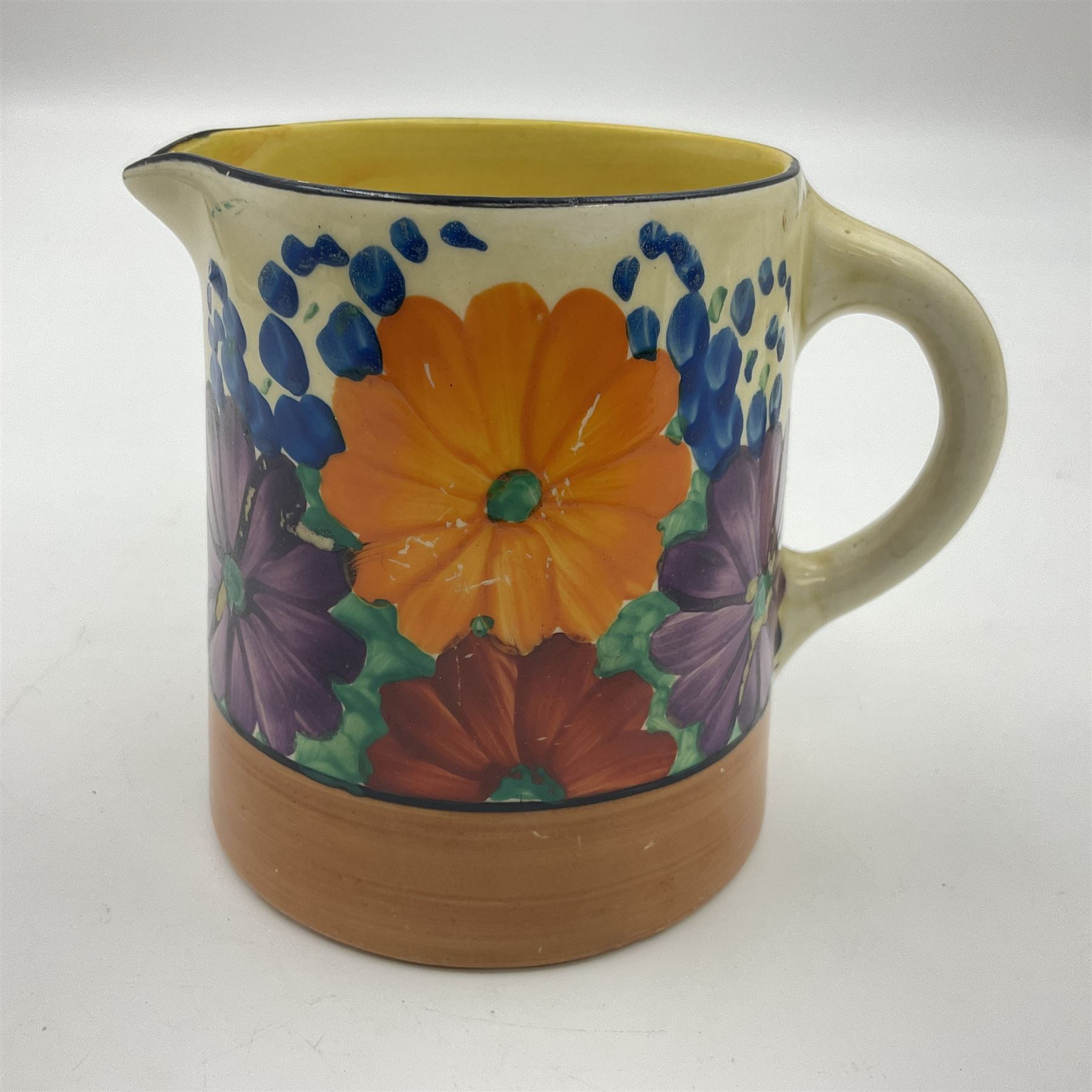 Clarice Cliff Bizarre milk jug decorated in the 'Gayday' Pattern, H8cm 
