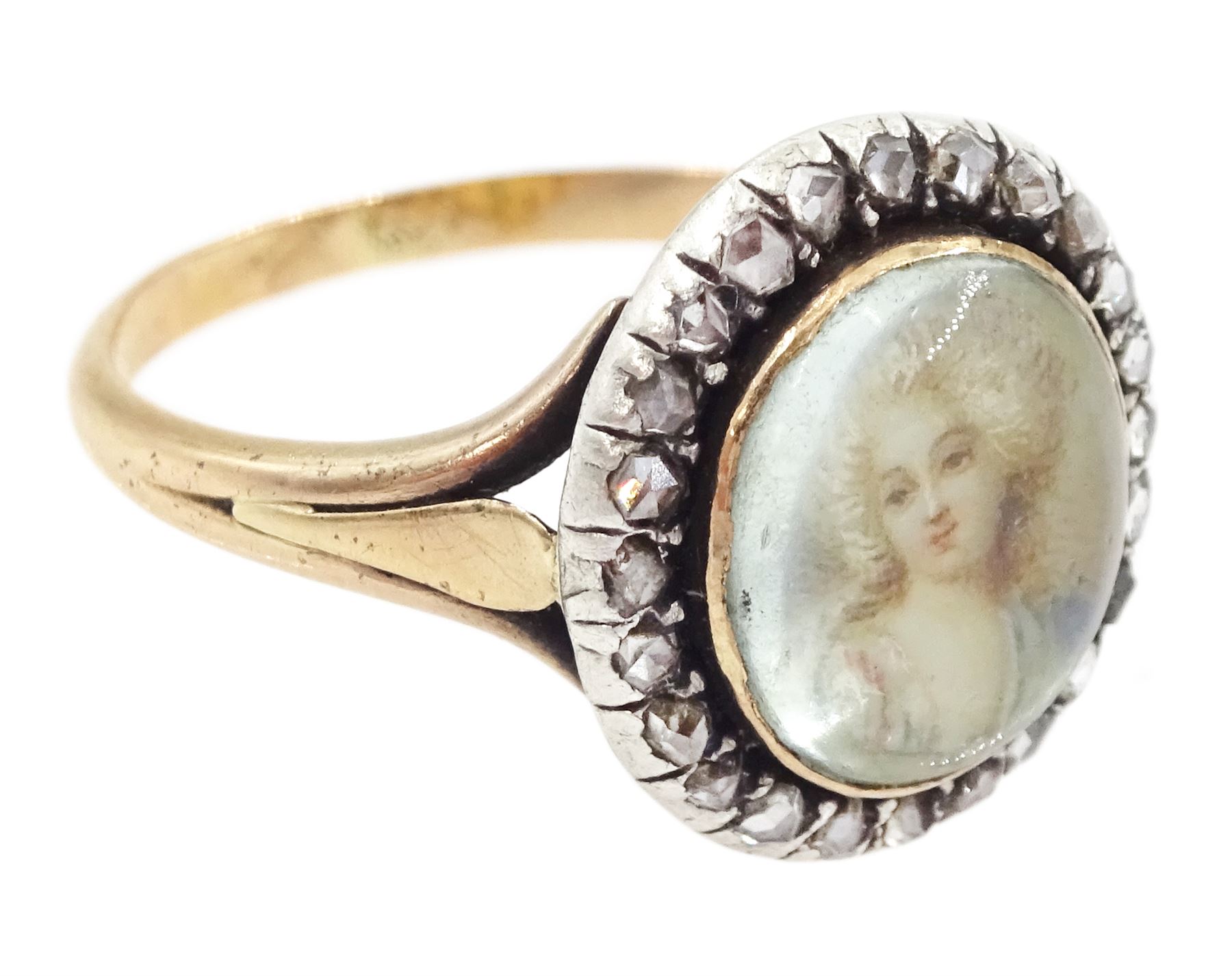 19th century French 18ct gold and silver diamond portrait ring, set with an oval miniature of a woman in 18th century dress on ivory, under a glazed panel, with rose cut diamond surround and trifurcated shoulders, hallmarked. This lot has been registered for sale under Section 10 of the APHA Ivory Act