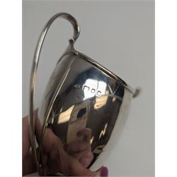 1920s silver cream jug, of helmet form with loop handle and upon a square base, hallmarked Charles Edwards, London 1926, including handle H15cm